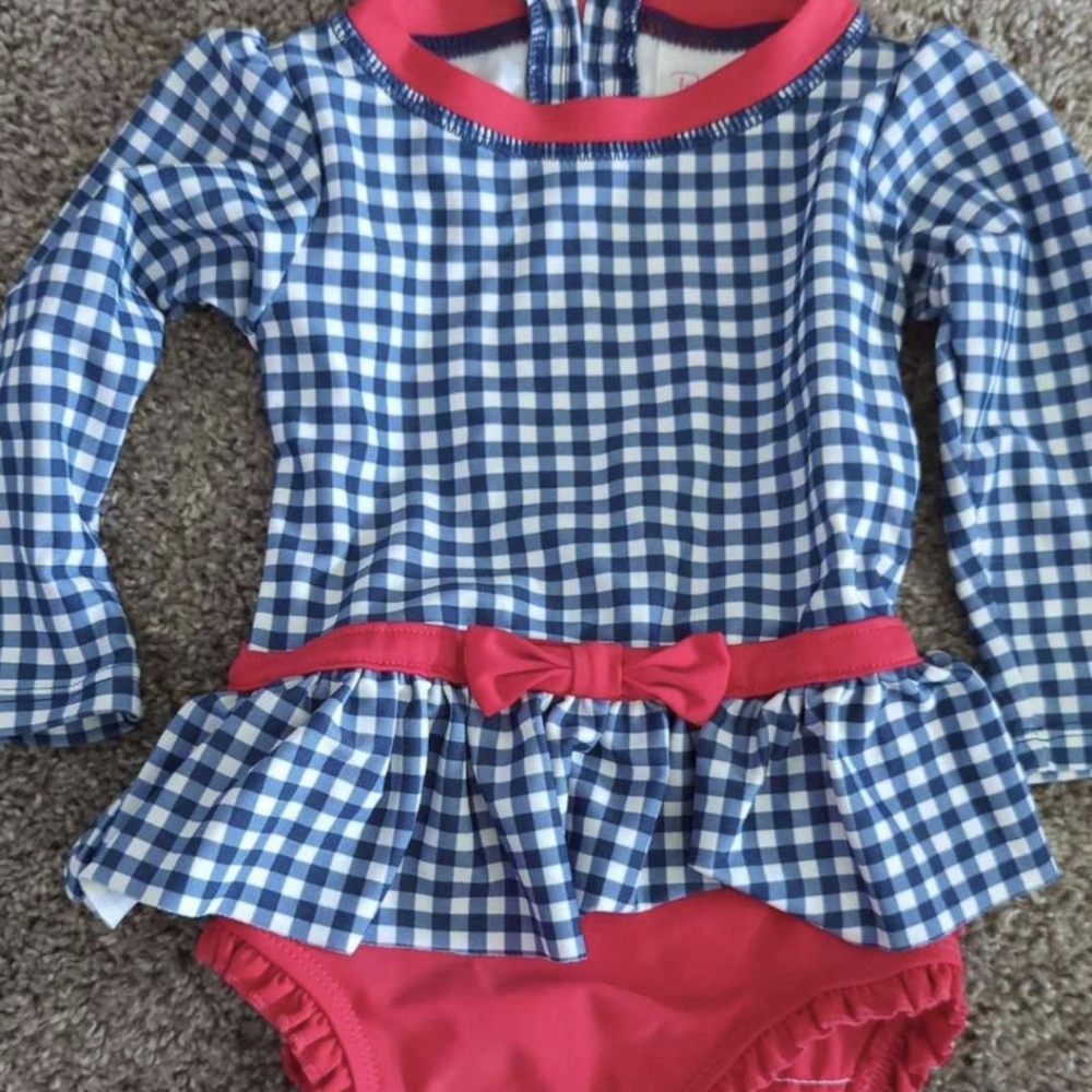 Rufflebutts peplum long sleeve swimsuit